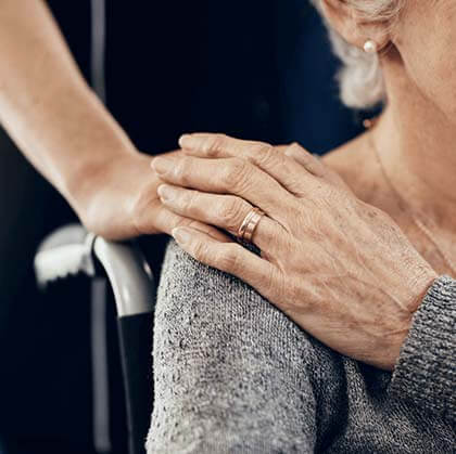 Holding hands with older woman